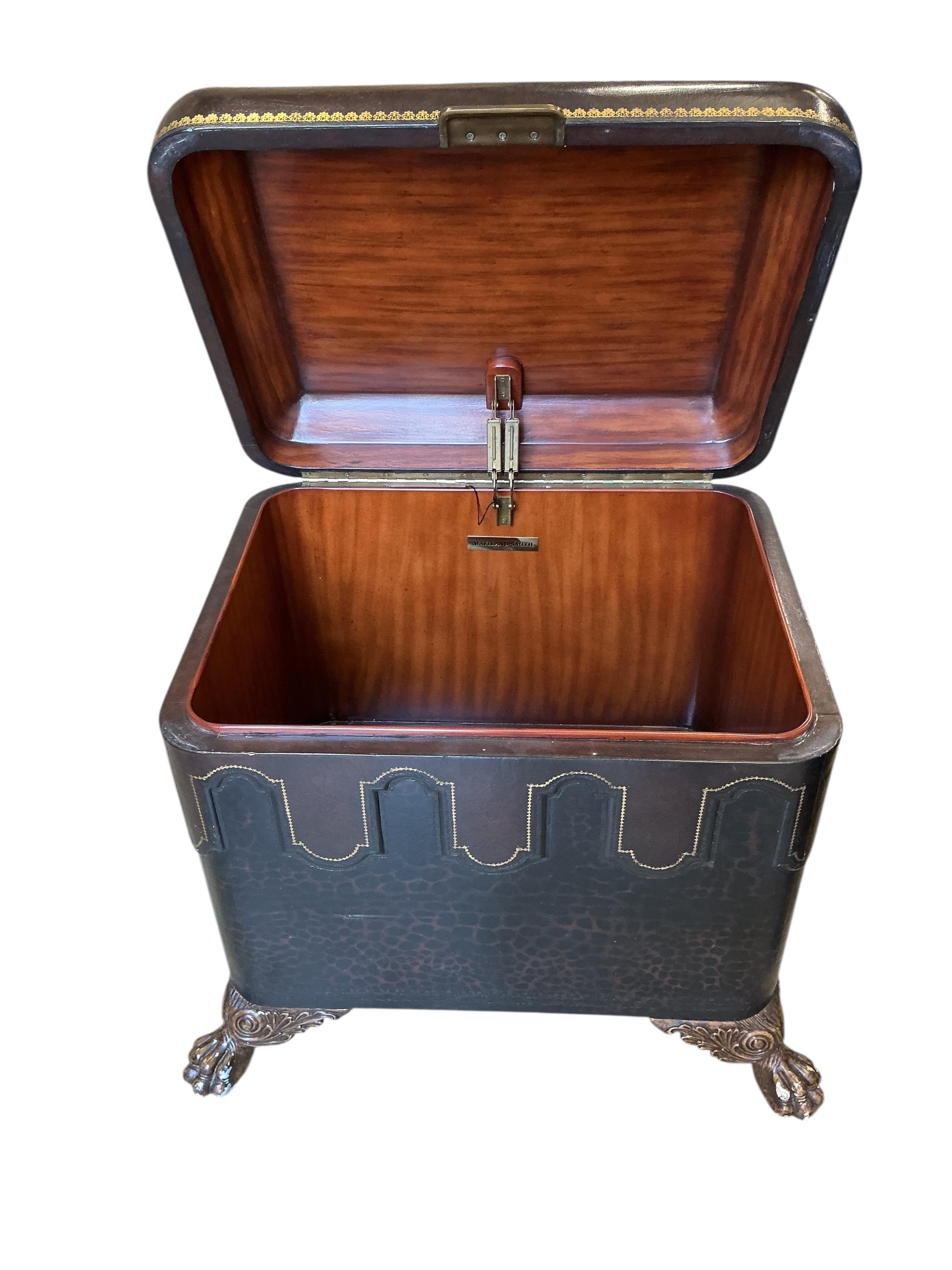 A pair of Contemporary Maitland Smith leather covered, leopard print trunks on lions paw feet, width 74cm, depth 58cm, height 60cm